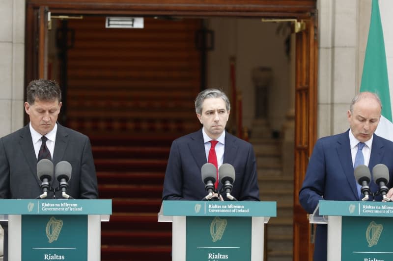 (L-R) Irish Minister for the Environment, Climate and Communications and Minister for Transport Eamon Ryan, Taoiseach Simon Harris and Tanaiste Micheal Martin speak to the media during a press conference outside the Government Buildings, as the Republic of Ireland recognised the state of Palestine. Damien Storan/PA Wire/dpa