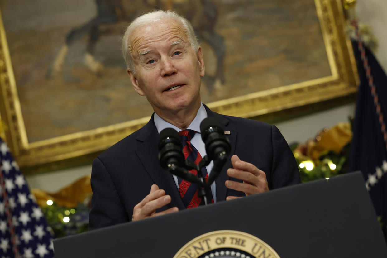 President Biden speaks from a podium at the White House.