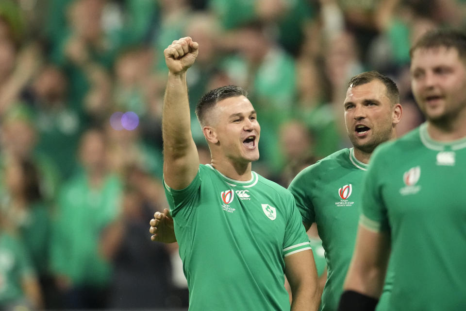 Ireland's Johnny Sexton, left, and Tadhg Beirne celebrate after the Rugby World Cup Pool B match between Ireland and Scotland at the Stade de France in Saint-Denis outside of Paris, Saturday, Oct. 7, 2023. Ireland won the match 36-14. (AP Photo/Christophe Ena)