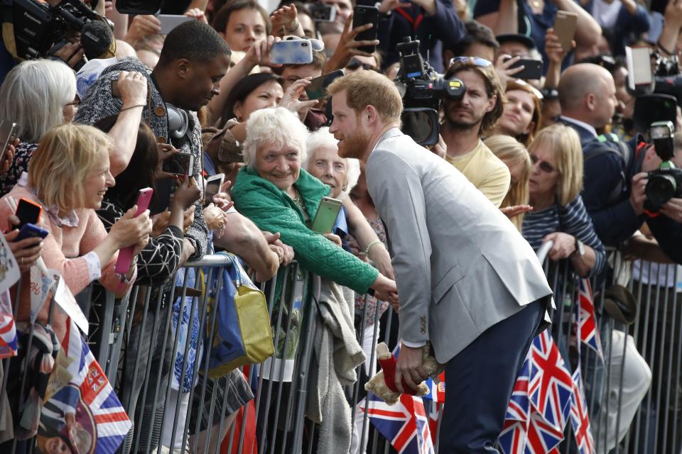 Prince Harry greeted excited well-wishers outside of Windsor Castle.