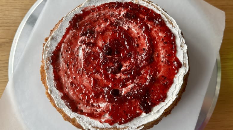 strawberry jam on frosted cake
