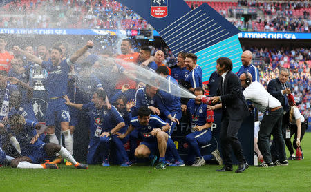 Soccer Football - FA Cup Final - Chelsea vs Manchester United - Wembley Stadium, London, Britain - May 19, 2018 Chelsea manager Antonio Conte celebrates winning the FA Cup by spraying sparkling wine over his players and staff Action Images via Reuters/Lee Smith