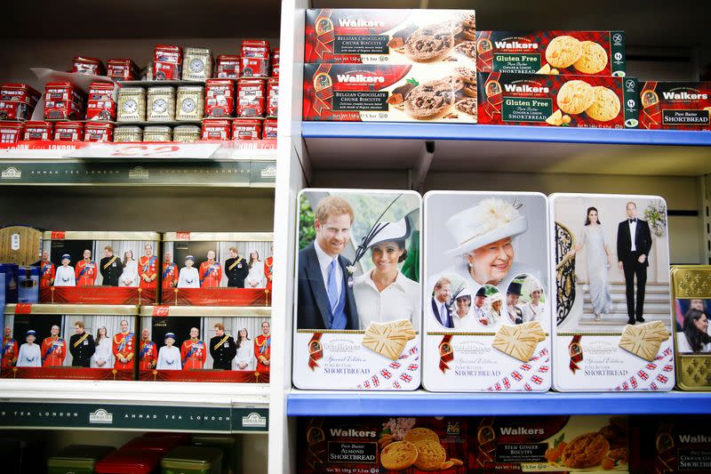 Merchandise depicting Britain's Prince Harry and Meghan, Duchess of Sussex, are seen on display in a souvenir shop near Buckingham Palace in London