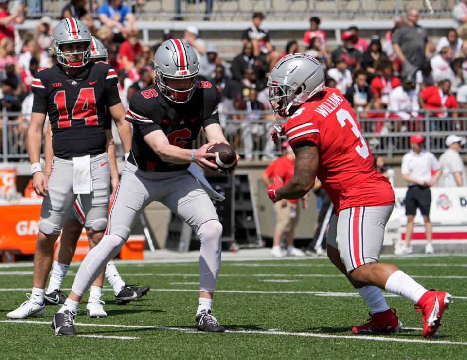 April 15, 2023; Columbus, Ohio, USA;  
Quarterback Kyle McCord (6) hands off the ball to running back Miyan Williams (3) during warmups before the Ohio State spring football game Saturday at Ohio Stadium.
Mandatory Credit: Barbara J. Perenic/Columbus Dispatch