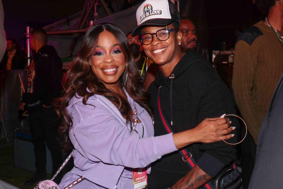 <p>Christopher Polk/Variety via Getty </p> Niecy Nash and wife Jessica Betts at LA Pride in the Park on June 9.