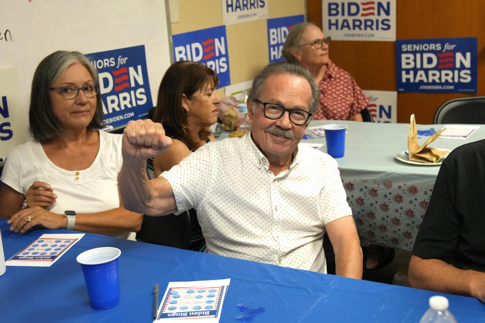 Richard Sauderson wins a game of bingo at a campaign event for seniors in support of President Joe Biden's reelection campaign, Thursday, June 13, 2024, in Phoenix. (AP Photo/Rick Scuteri)