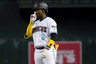 Arizona Diamondbacks' Geraldo Perdomo (2) motions to his dugout after hitting an RBI base hit against the Miami Marlins during the fourth inning of a baseball game, Wednesday, May 10, 2023, in Phoenix. (AP Photo/Matt York)