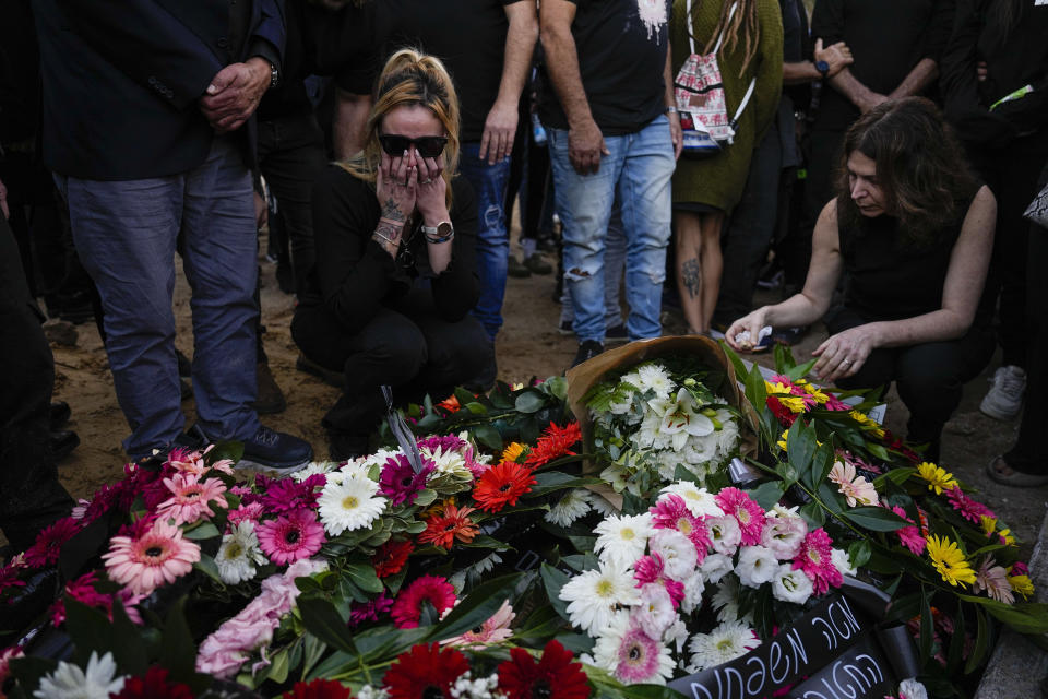 Mourners gather in grief during the funeral of Shani Gabay in the northern Israeli town of Yokneam, Thursday, Nov. 23, 2023. Gabay, 25, was killed with at least 360 Israelis by Hamas militants at the outdoor music festival, among the total 1,200 people killed during Hamas' bloody Oct. 7 cross-border assault. (AP Photo/Ariel Schalit)
