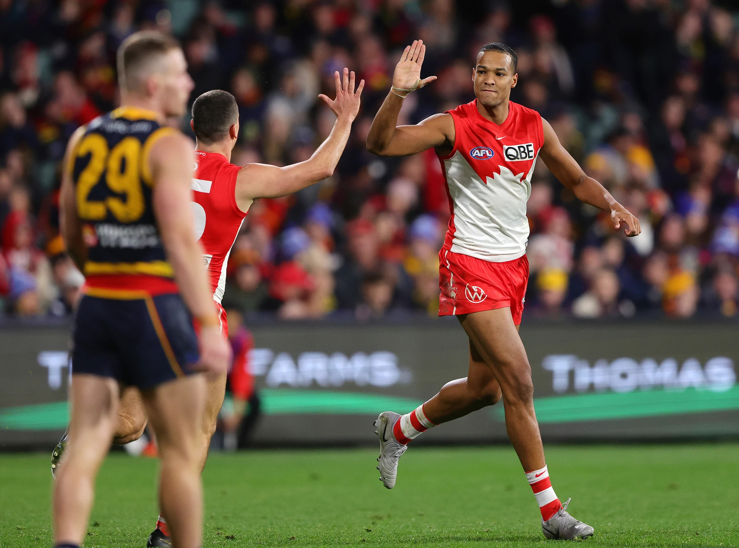 ADELAIDE, AUSTRALIA - JUNE 15: Joel Amartey of the Swans celebrates a goal during the 2024 AFL Round 14 match between the Adelaide Crows and the Sydney Swans at Adelaide Oval on June 15, 2024 in Adelaide, Australia. (Photo by Sarah Reed/AFL Photos via Getty Images)