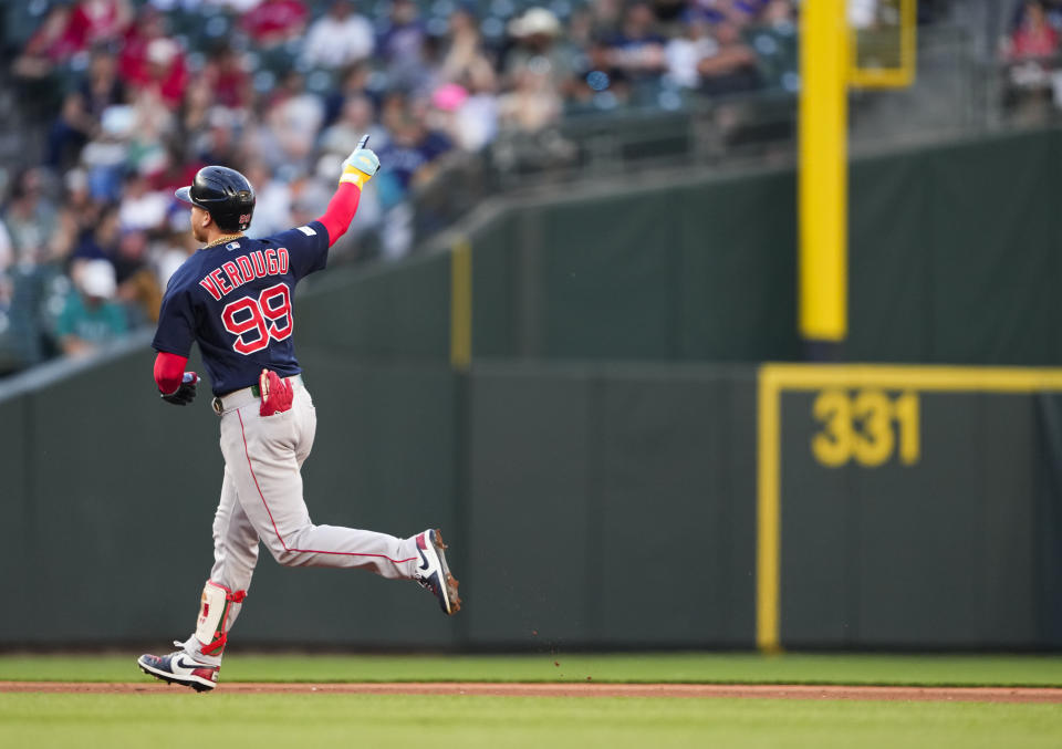 Boston Red Sox's Alex Verdugo points to the bullpen as he rounds the bases after hitting a two-run home run against the Seattle Mariners during the fifth inning of a baseball game, Tuesday, Aug. 1, 2023, in Seattle. (AP Photo/Lindsey Wasson)