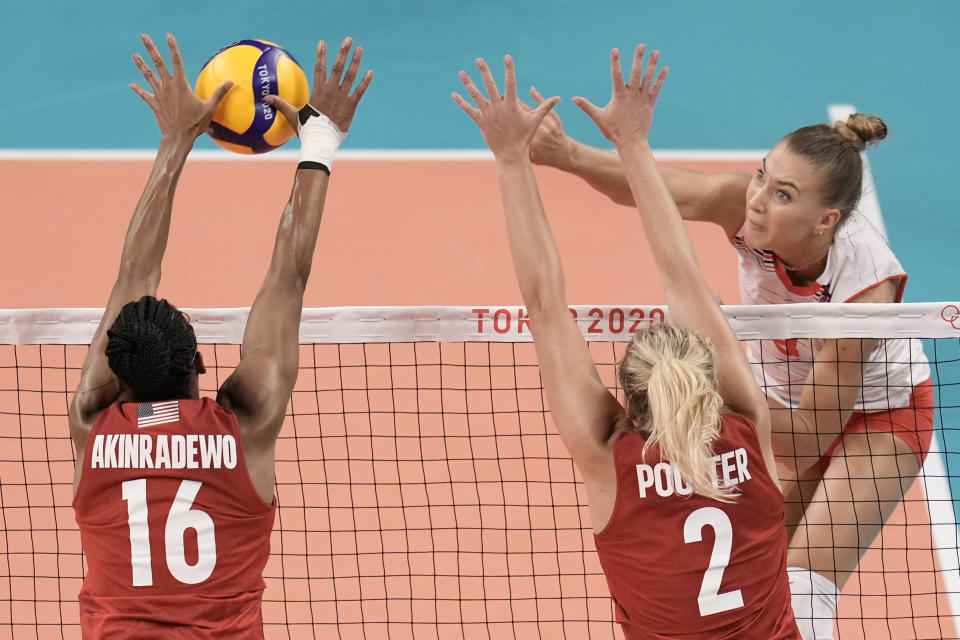 Foluke Akinradewo, of the United States, blocks a spike by Turkey's Meliha Ismailoglu, during a women's volleyball preliminary round pool B match, at the 2020 Summer Olympics, Thursday, July 29, 2021, in Tokyo, Japan. (AP Photo/Manu Fernandez)