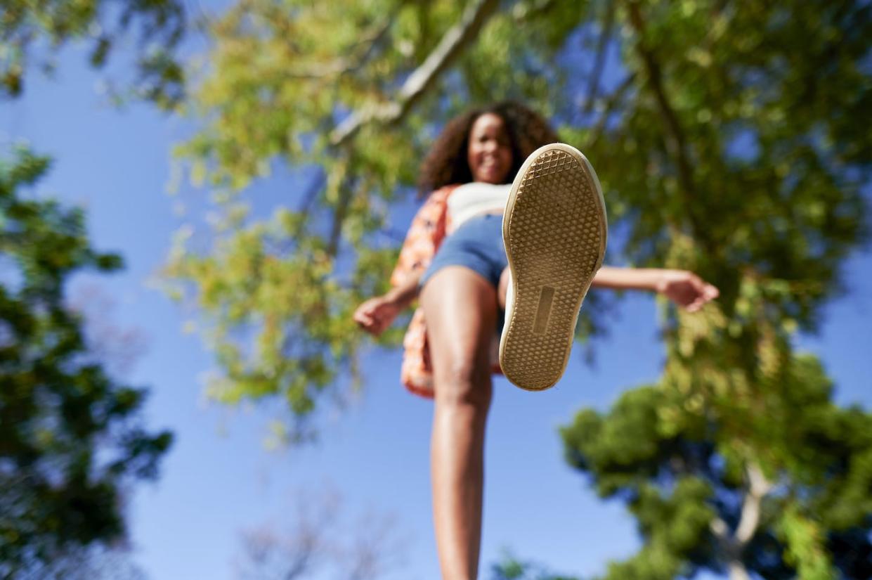 You don't need to watch where you step when it comes to bacteria. <a href="https://www.gettyimages.com/detail/photo/woman-walking-in-park-on-sunny-day-royalty-free-image/1326118536" rel="nofollow noopener" target="_blank" data-ylk="slk:Westend61/Getty Images;elm:context_link;itc:0;sec:content-canvas" class="link ">Westend61/Getty Images</a>