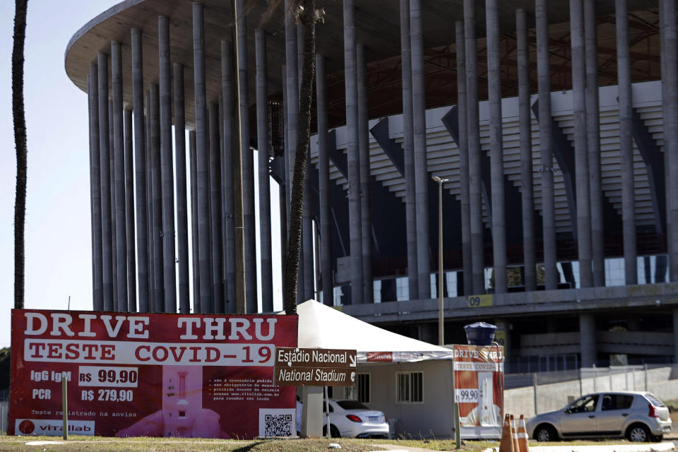 A COVID-19 testing site stands outside the National Stadium in Brasilia, Brazil, Friday, June 4, 2021. The National Stadium will host some Copa America soccer games. (AP Photo/Eraldo Peres)