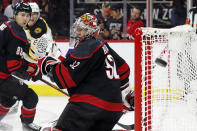 Carolina Hurricanes goaltender Antti Raanta (32) watches a shot from the Boston Bruins pass by during the third period of Game 7 of an NHL hockey Stanley Cup first-round playoff series in Raleigh, N.C., Saturday, May 14, 2022. (AP Photo/Karl B DeBlaker)
