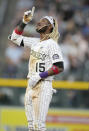 Colorado Rockies' Raimel Tapia gestures after reaching second base with a double off Texas Rangers starting pitcher Jordan Lyles during the fifth inning of a baseball game Wednesday, June 2, 2021, in Denver. (AP Photo/David Zalubowski)