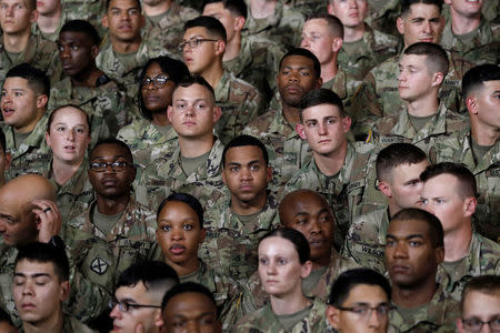 U.S. Army 10th Mountain Division soldiers listen as President Donald Trump speaks before signing the National Defense Authorization Act at Fort Drum, New York, U.S., August 13, 2018. REUTERS/Carlos Barria