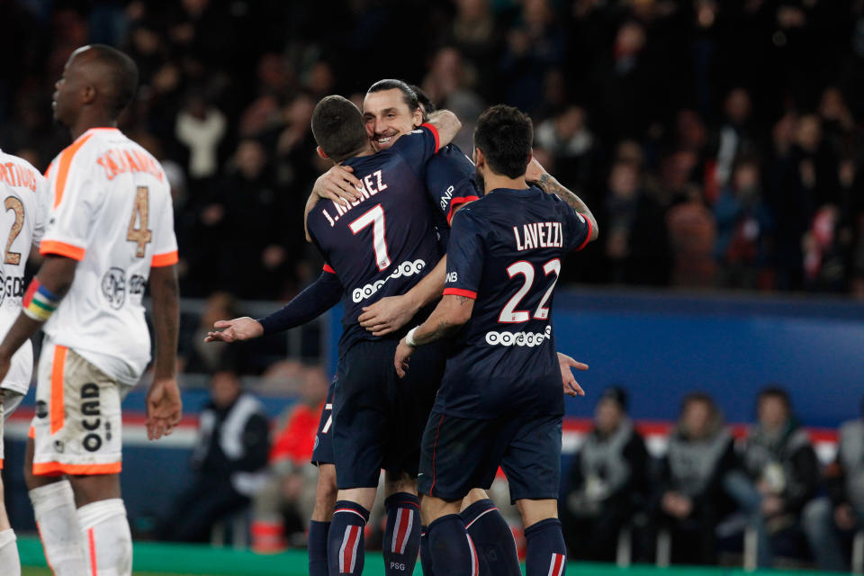 Paris Saint Germain's Zlatan Ibrahimovic, center, celebrates with teammates after scoring a goal, during their French League one soccer match against Valenciennes, at the Parc des Princes stadium, in Paris, Friday, Feb. 14, 2014. (AP Photo/Thibault Camus)
