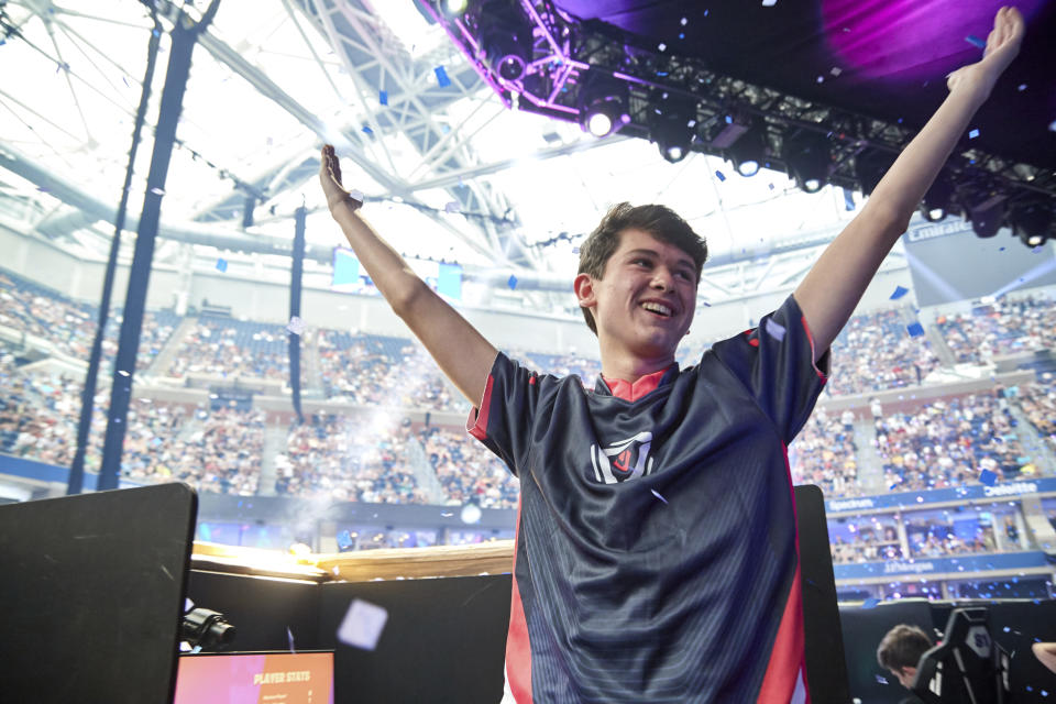 In this Sunday, July 28, 2019 photo provided by Epic games, Kyle Giersdorf reacts after he won the Fortnite World Cup solo finals in New York. Giersdorf, of Pottsgrove, Pa. who goes by the name "Bugha" when competing, racked up the most points and won $3 million as the first Fortnite World Cup solo champion. (Epic Games via AP)