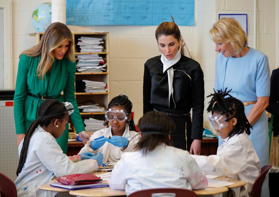 From left, First lady Melania Trump, Queen Rania of Jordan, and Education Secretary Betsy DeVos talk with students during a science class at the Excel Academy Public Charter school in Washington, Wednesday, April 5, 2017 - Credit: AP