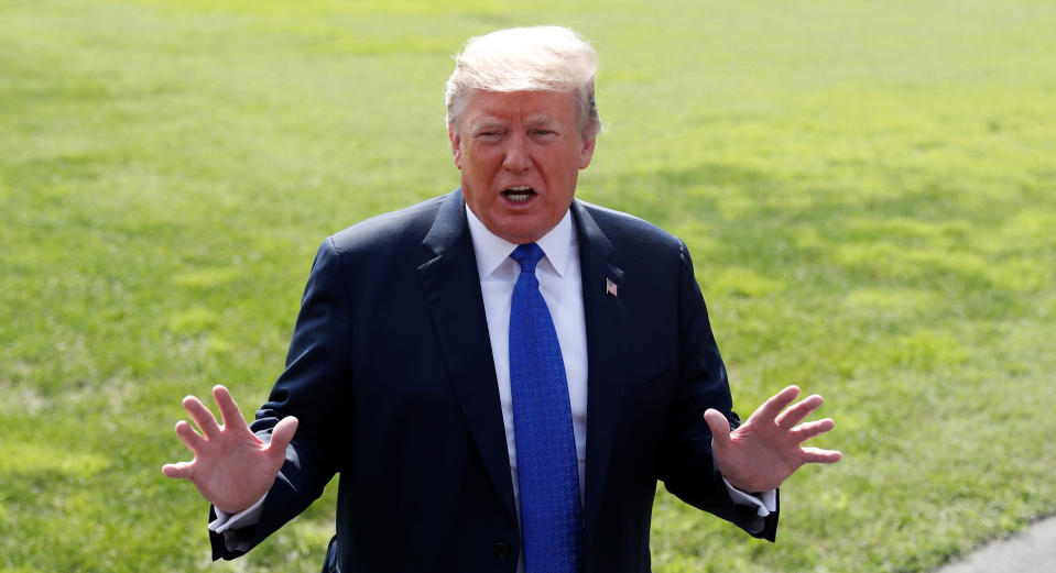 President Trump talks to reporters on the South Lawn of the White House Tuesday before boarding Marine One for a trip to Pennsylvania and Tennessee. (Photo: Reuters/Leah Millis)