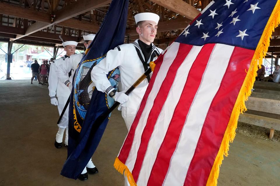 Members of the Meridian Naval Air Station Honor Guard carry out the American flag after its presentation in this file photo.