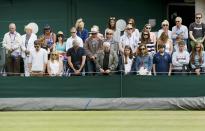 Spectators observe a minutes silence in memory of the 7/7 bombings in London at the Wimbledon Tennis Championships in London, July 7, 2015. (REUTERS/Stefan Wermuth)