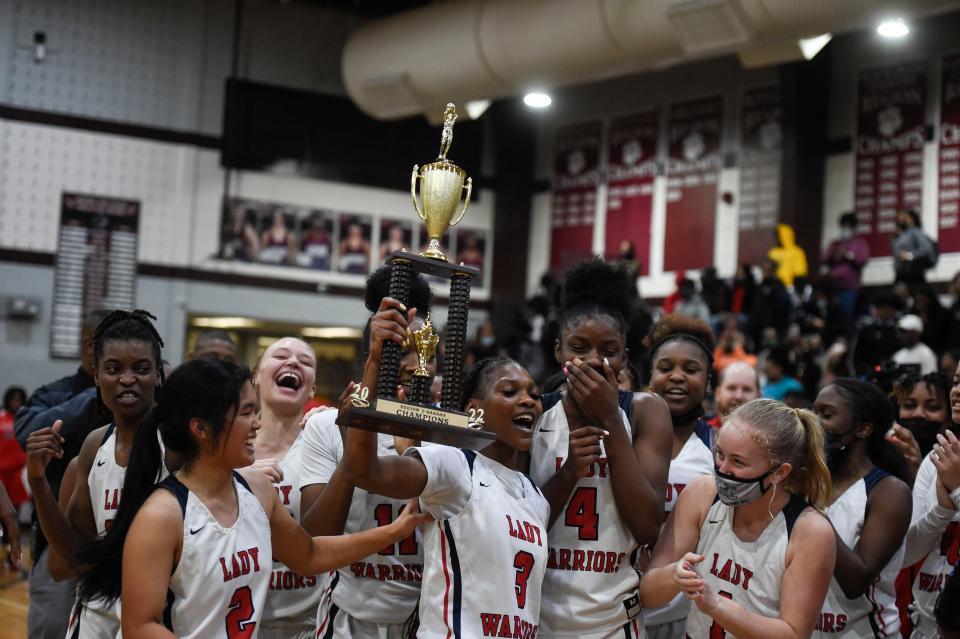 The Grovetown girls basketball team celebrates their win before the Grovetown and Evans Region 3 6A tournament final at Lakeside High School on Friday, Feb. 18, 2022. Grovetown defeated Evans 84-62. 