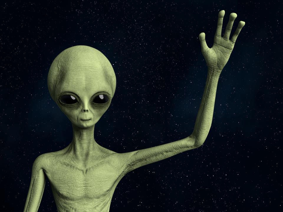 An illustration of an Alien waving.