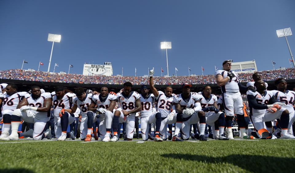 Denver Broncos team take a knee during the national anthem during their game against the Buffalo Bills on September 24, 2017 at New Era Field in Orchard Park, NY. (Photo by John Leyba/The Denver Post via Getty Images)