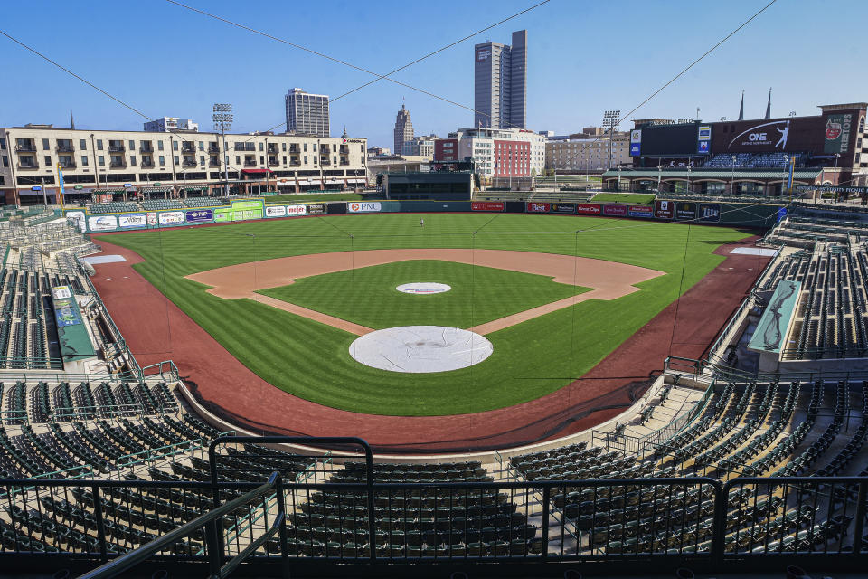 FILE - In this April 8, 2020, file photo, an empty Parkview Field minor league baseball stadium is shown in downtown Fort Wayne, Ind. Unlike the NFL, NBA or Major League Baseball that can run on television revenue, it's impossible for some minor sports leagues in North America to go on in empty stadiums and arenas in light of the coronavirus pandemic. These attendance-driven leagues might not play again at all in 2020, putting some teams in danger of surviving at all and potentially changing the landscape of minor league sports in the future. (Mike Moore/The Journal-Gazette via AP, File)