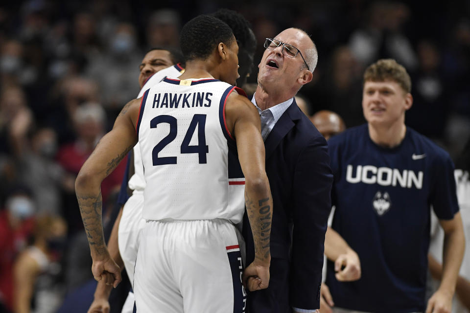 Connecticut's Jordan Hawkins (24) and Connecticut head coach Dan Hurley react in the first half of an NCAA college basketball game against Grambling State, Saturday, Dec. 4, 2021, in Storrs, Conn. (AP Photo/Jessica Hill)