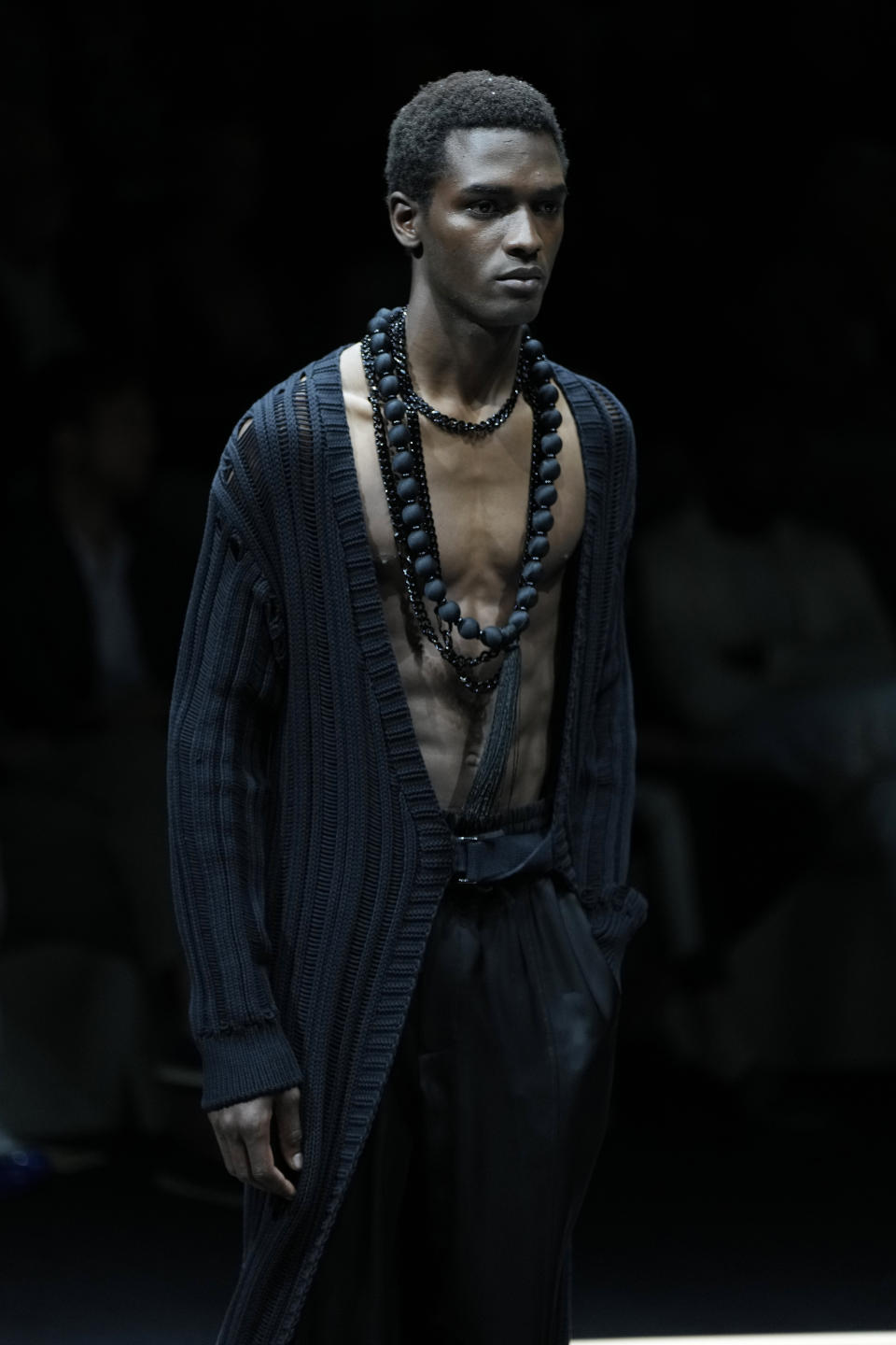 A model wears a creation as part of the Emporio Armani men's Spring Summer 2024 collection presented in Milan, Italy, Saturday, June 17, 2023. (AP Photo/Luca Bruno)