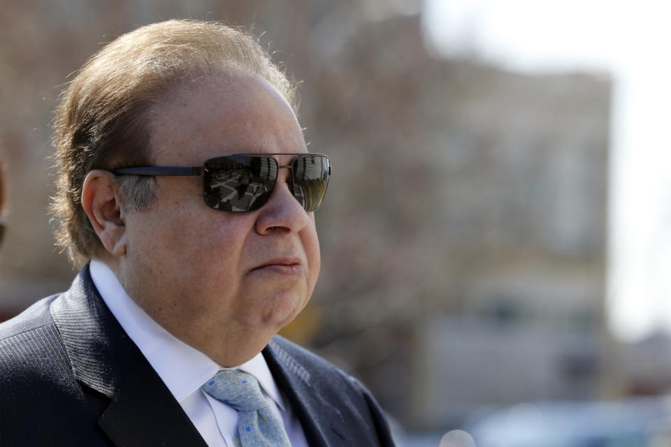 FILE - In this April 2, 2015 file photo, Dr. Salomon Melgen arrives at the Martin Luther King Jr. Federal Courthouse for his arraignment in Newark, N.J. The prominent Florida eye doctor, convicted of defrauding Medicare out of $73 million, got out of prison early on Wednesday, Jan. 20, 2021, after former President Donald Trump commuted his sentence just hours before his term ended. (AP Photo/Julio Cortez, File)