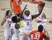 Nebraska forward Lat Mayen (11) pulls in a defensive rebound next to Illinois' Coleman Hawkins (33) during the first half of an NCAA college basketball game Friday, Feb. 12, 2021, in Lincoln, Neb. (Francis Gardler/Lincoln Journal Star via AP)