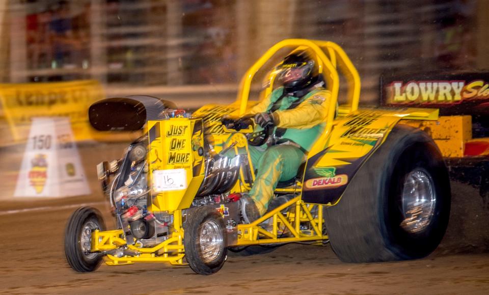 A competitor in the mini-rod roars down the arena floor during the Truck and Tractor Pulls on Wednesday, July 17, 2019 at the HOI Fair.