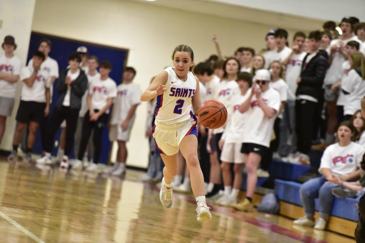 St. Clair's Brooke Grazia dribbles down the court during a game earlier this season. She finished with seven points in the Saints' 48-16 win over St. Clair Shores Lake Shore on Thursday.