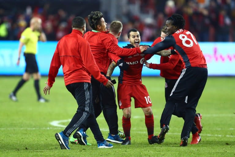 Sebastian Giovinco (C) of Toronto FC celebrates victory over the Seattle Sounders in the 2017 MLS Cup Final