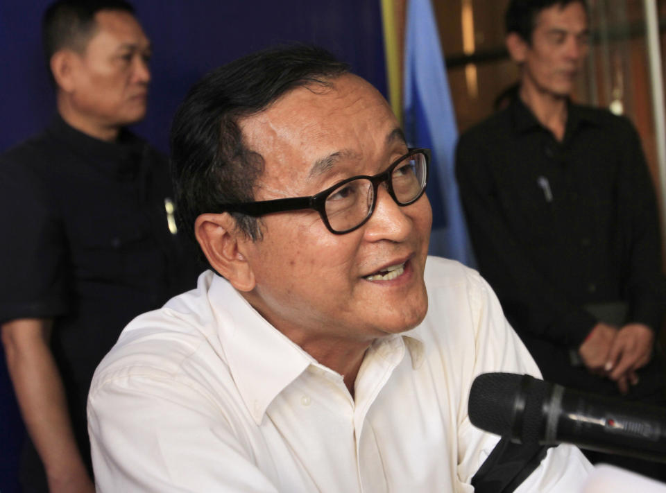 Cambodia's opposition leader Sam Rainsy of Cambodia National Rescue Party speaks during a press conference for a future rally plan at their party's headquarters in Phnom Penh, Cambodia, Saturday, Jan. 4, 2014. Cambodian police have pushed out about 1,000 anti-government demonstrators from a park in the capital Phnom Penh, a day after four people were killed in a crackdown on a labor protest. (AP Photo/Heng Sinith)