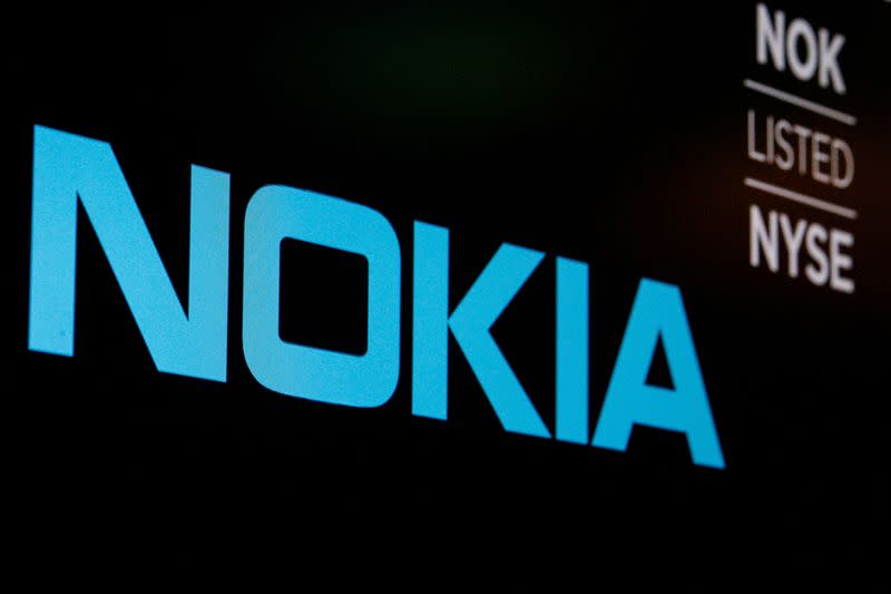 FILE PHOTO: The logo and ticker for Nokia are displayed on a screen on the floor of the NYSE in New York