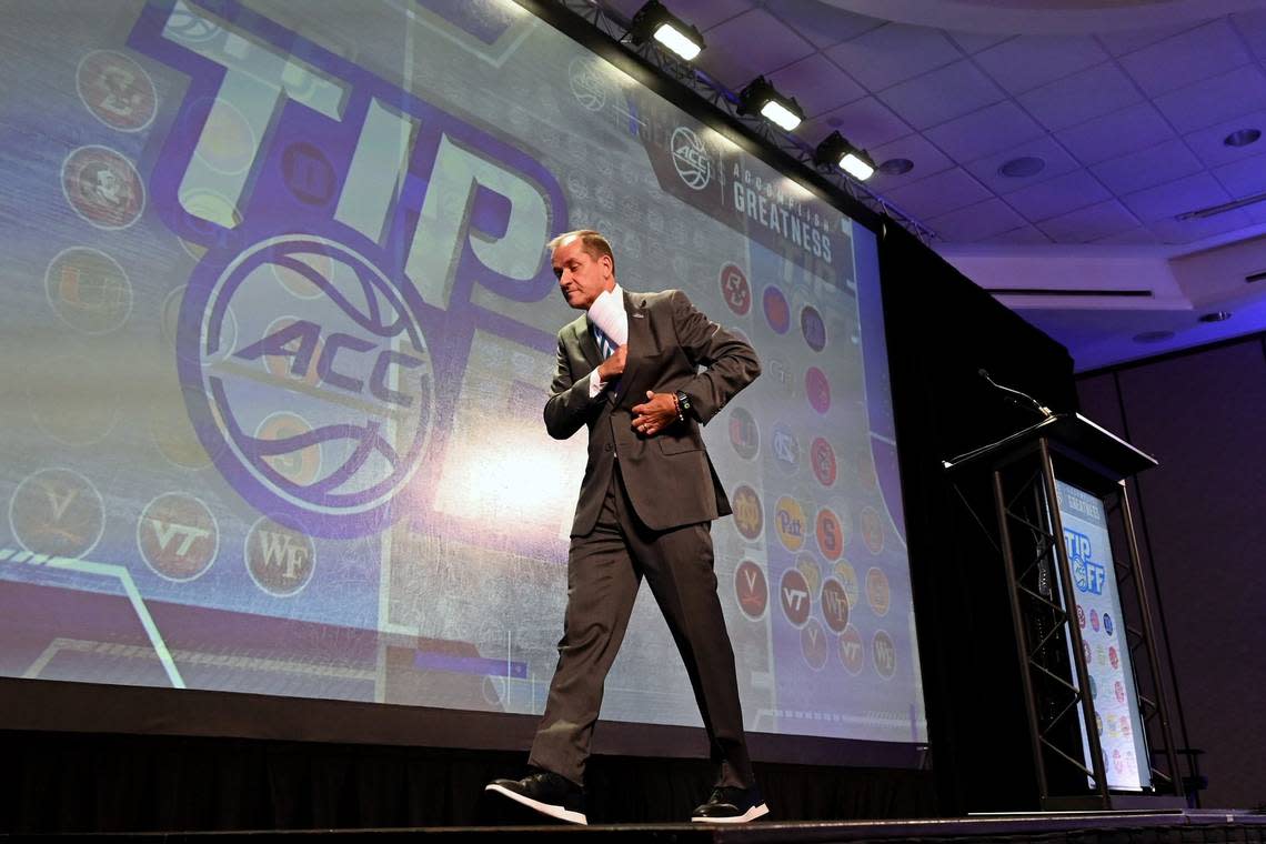 ACC Commissioner Jim Phillips secures his speech following his address to the media during the ACC Men’s TipOff event at the Hilton Charlotte Uptown Hotel on Wednesday, October 25, 2023 in Charlotte, NC.