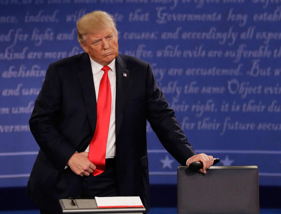 <p>Republican presidential nominee Donald Trump listens to Democratic presidential nominee Hillary Clinton during the second presidential debate at Washington University in St. Louis, Mo., Sunday, Oct. 9, 2016. (Photo: Patrick Semansky/AP) </p>