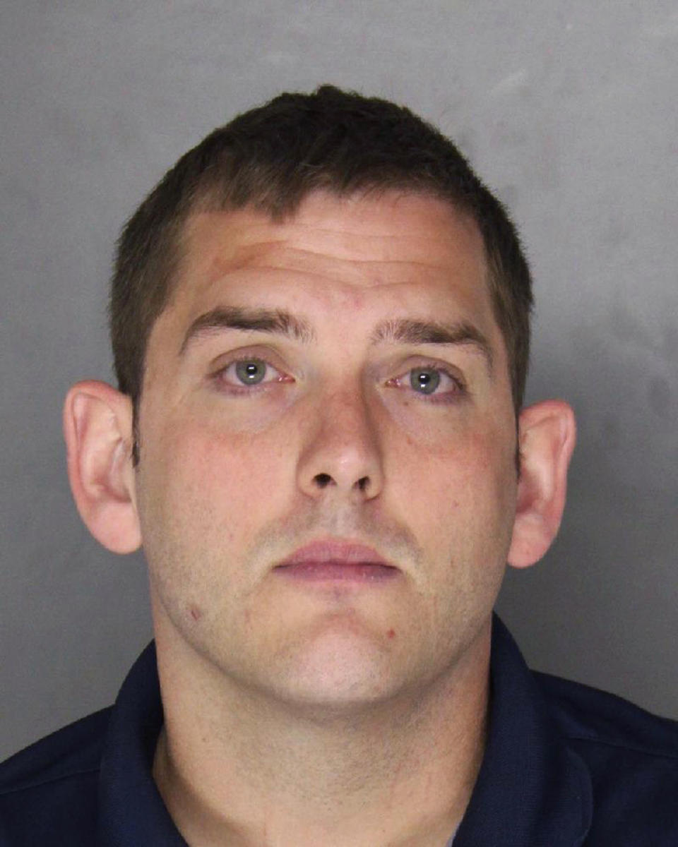 FILE – This undated file photo provided by the Allegheny County District Attorney shows Michael Rosfeld, a former police officer in East Pittsburgh, Pa. Rosfeld was charged with criminal homicide June 27, 2018, following the fatal shooting of Antwon Rose Jr. as he fled during a traffic stop on June 19, 2018. The jury selection for Rosfeld's trial begins Tuesday in Harrisburg. A judge ruled a jury from outside the Pittsburgh area is needed because of widespread publicity about the case. The jurors will be taken to Allegheny County for the trial next week. (Allegheny County District Attorney via AP, File)