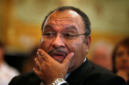 FILE PHOTO: Papua New Guinea's then Prime Minister Peter O'Neill pauses before making an address to the Lowy Institute in Sydney, Australia November 29, 2012. REUTERS/Tim Wimborne/File Photo