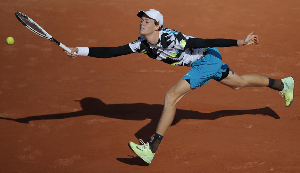 FILE - Italy's Jannik Sinner plays a shot against Germany's Alexander Zverev in the fourth round match of the French Open tennis tournament at the Roland Garros stadium in Paris, France, Sunday, Oct. 4, 2020. The French Open is scheduled to start Sunday on the red clay of Roland Garros on the outskirts of Paris.(AP Photo/Christophe Ena, File)