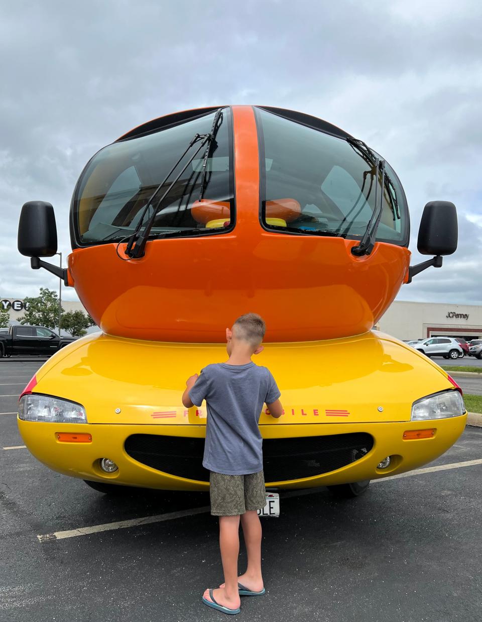 A boy is shown with the Oscar Mayer Frankmobile during one of its Northeast Ohio tour stops on Wednesday. The unique vehicle will be in downtown Canton on Friday.