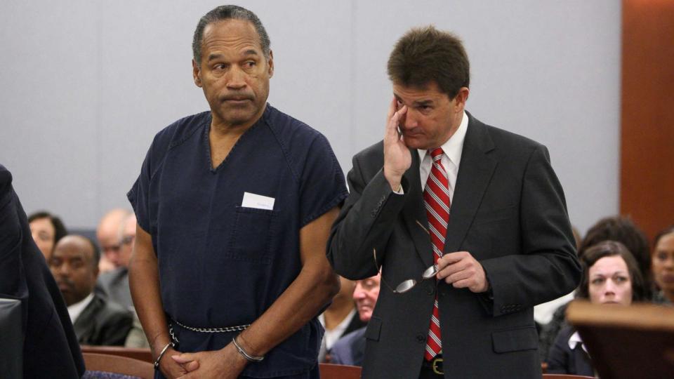 PHOTO: OJ Simpson stands in court with attorney Yale Galanter during his sentencing at the Clark County Regional Justice Center, Dec. 5, 2008, in Las Vegas.  (Issac Brekken-Pool/AFP/Getty Images)