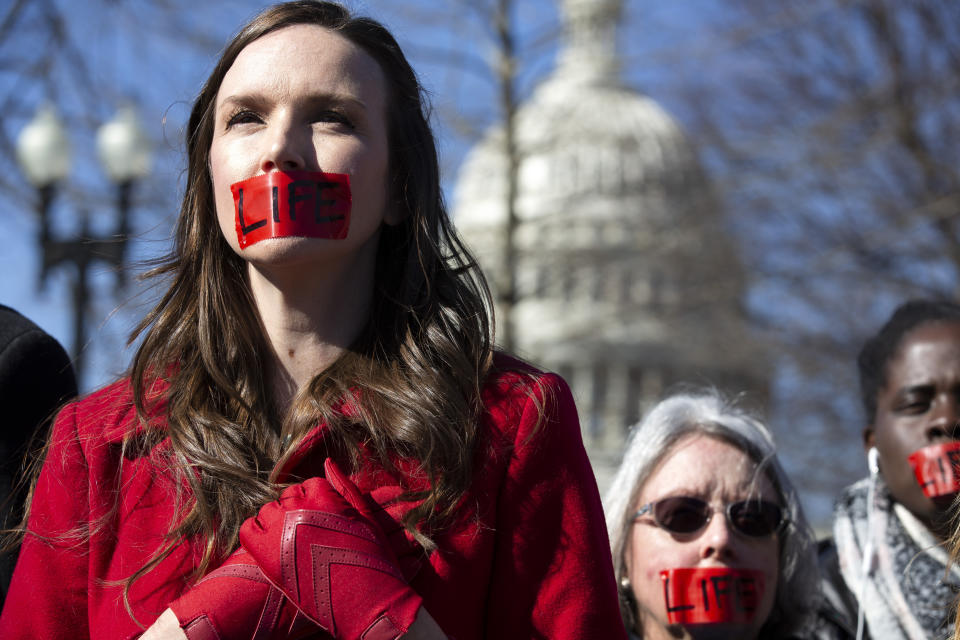 Anti-abortion demonstrators rally outside of the U.S. Supreme Court in Washington, Wednesday, March 4, 2020. The Supreme Court is taking up the first major abortion case of the Trump era Wednesday, an election-year look at a Louisiana dispute that could reveal how willing the more conservative court is to roll back abortion rights. (AP Photo/Jose Luis Magana)