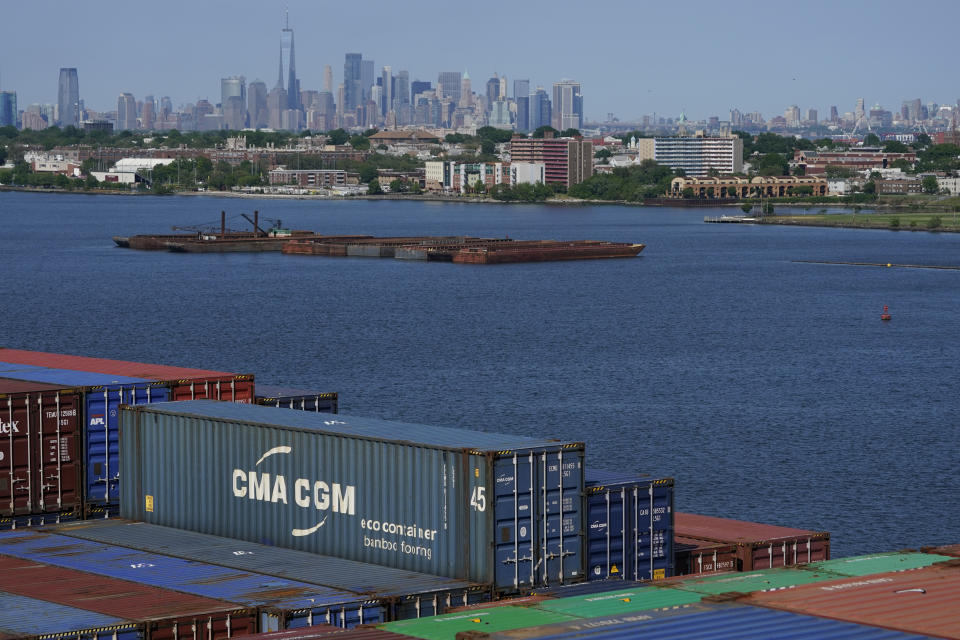 FILE - New York City is visible over the containers stacked on the CMA CGM Marco Polo in Elizabeth, N.J., Thursday, May 20, 2021. The U.S. Supreme Court ruled unanimously, Tuesday, April 18, 2023, that the Garden State doesn't need New York's consent to withdraw from the Waterfront Commission of New York Harbor. The commission was created in 1953 when organized crime had infiltrated the port and was demanding payments from workers and shippers through extortion and violence. (AP Photo/Seth Wenig, File)