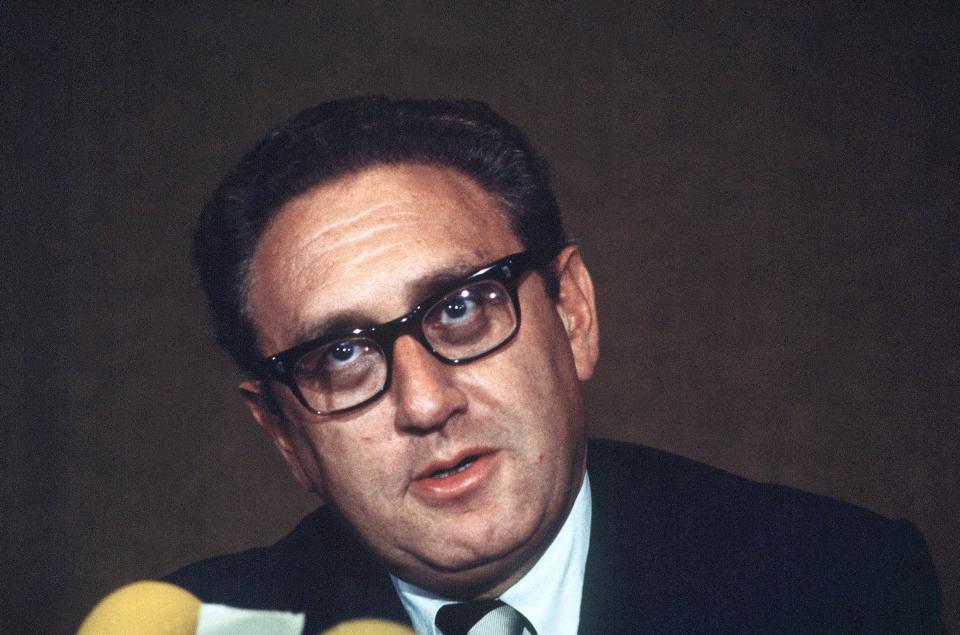 US National Security Advisor Henry Kissinger speaks to the press in Paris (AFP via Getty Images)