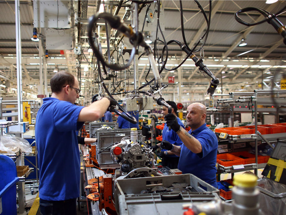 Employees in Europe working on a Ford car.